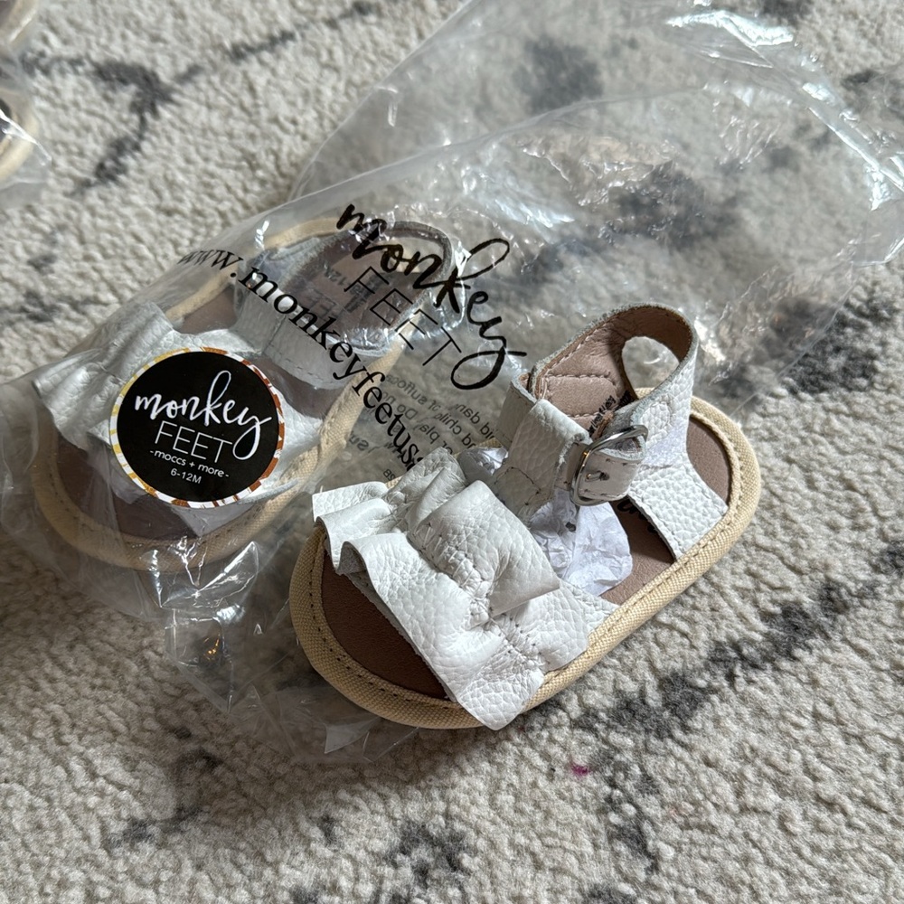 Monkey Feet sandals, brand new in packaging, color is white, size 6-12mth